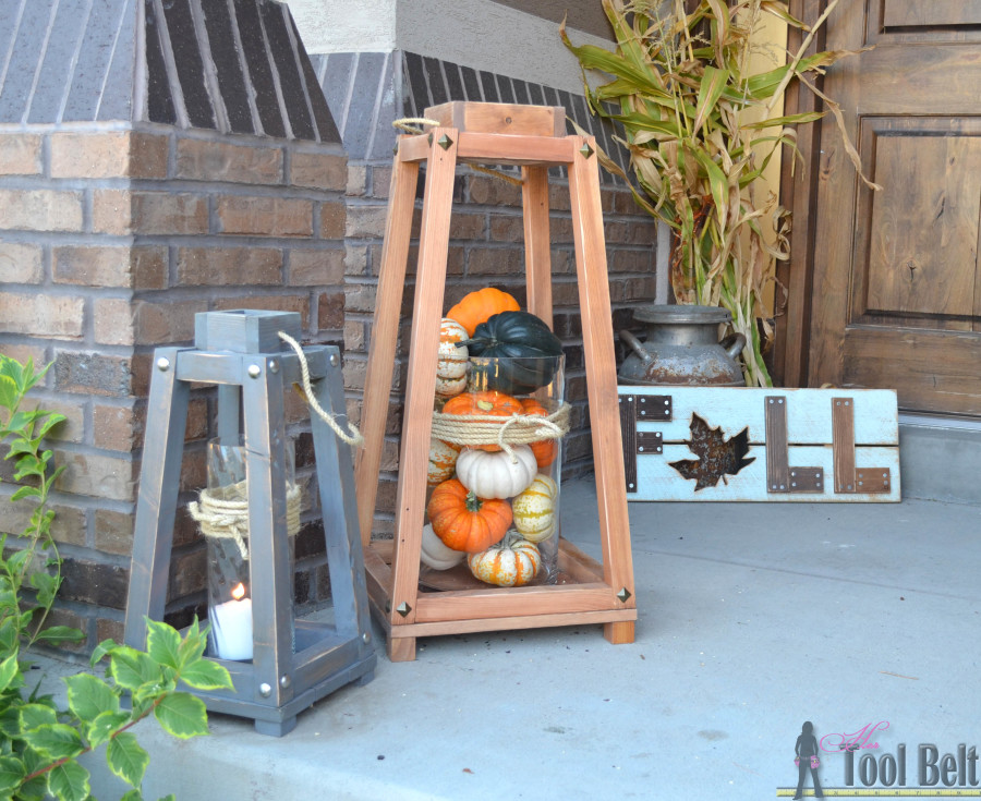 Two angled lanterns on a porch