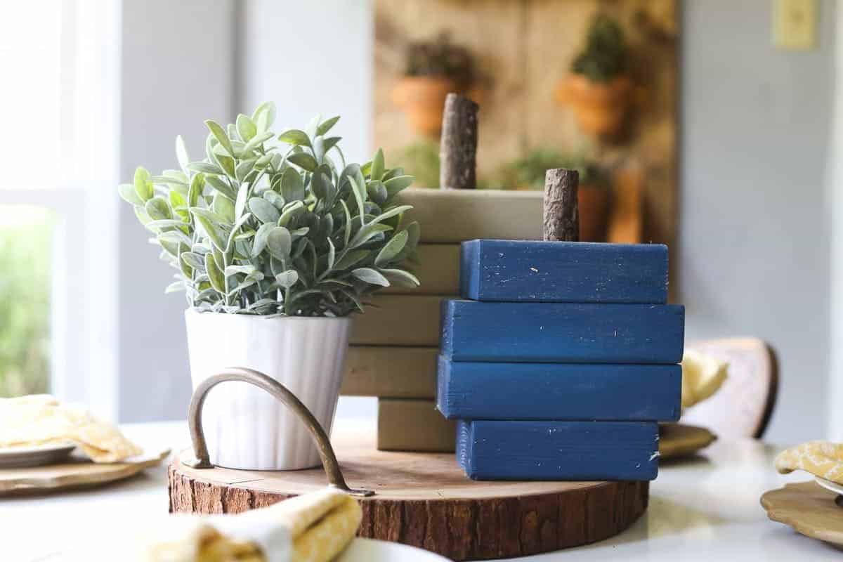 Several pieces of wood of varying lengths stacked to look like a pumpkin
