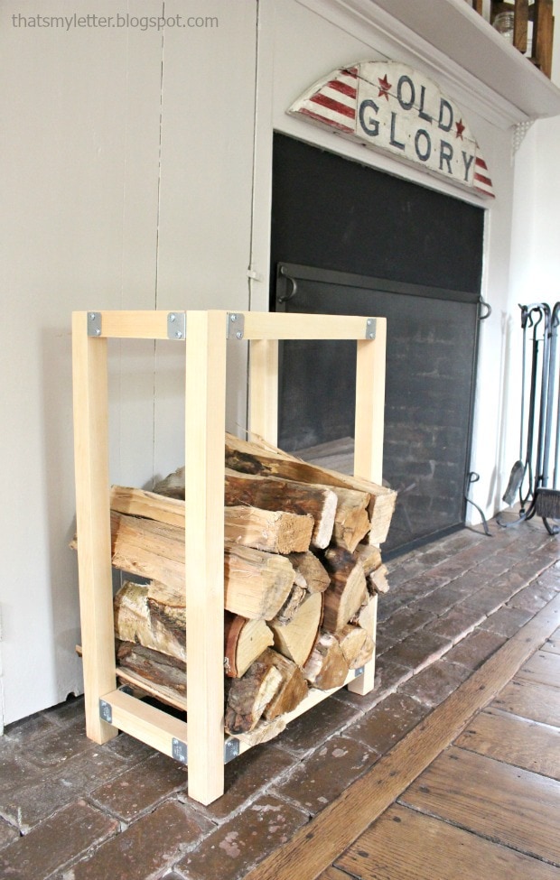 Log holder next to a fireplace