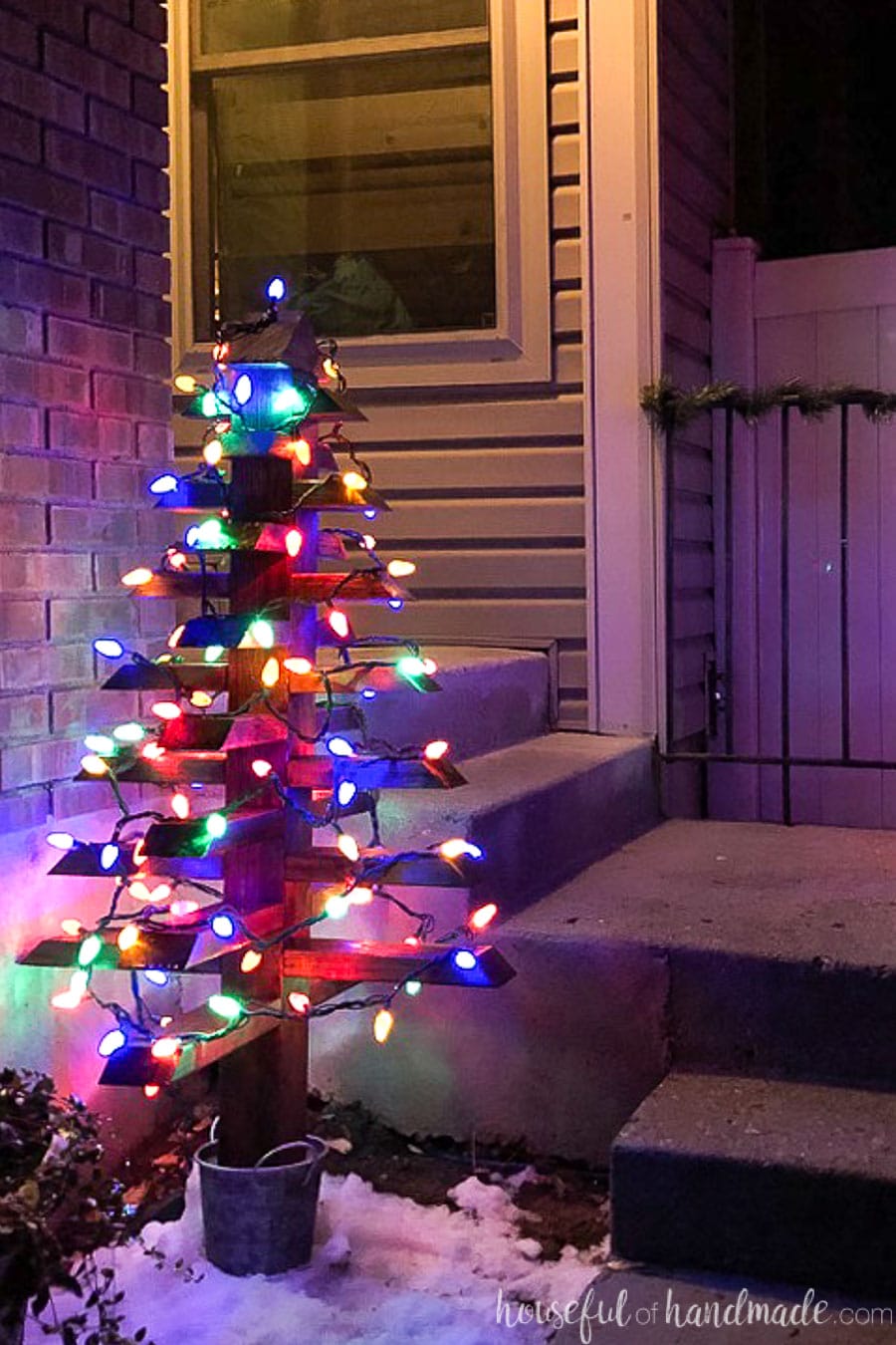 DIY outdoor wood Christmas tree with colored lights