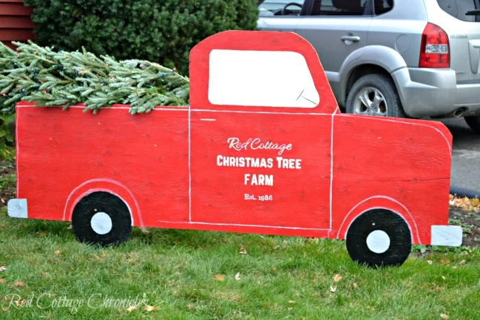 DIY red Christmas truck in a yard