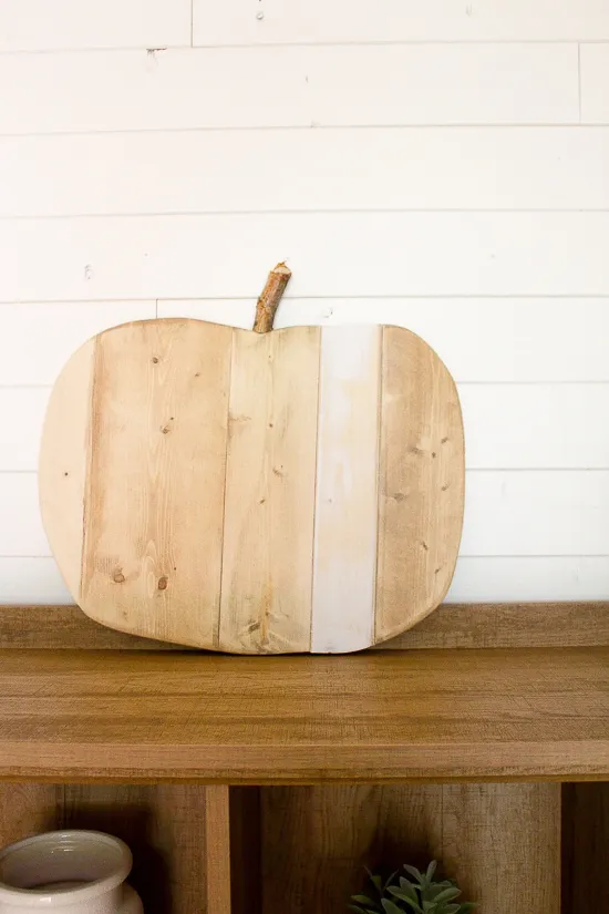 Wood planks side by side, cut in the shape of a pumpkin and left natural