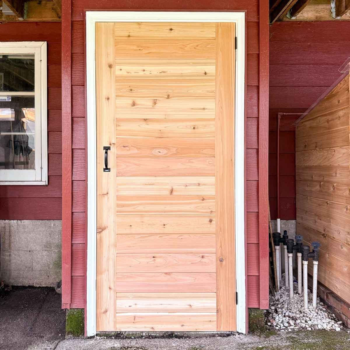 Cedar shed door with black handle