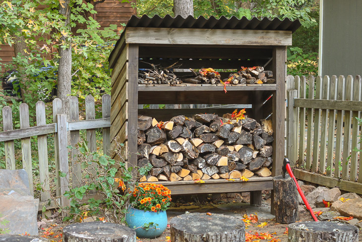 Firewood storage shed in a yard