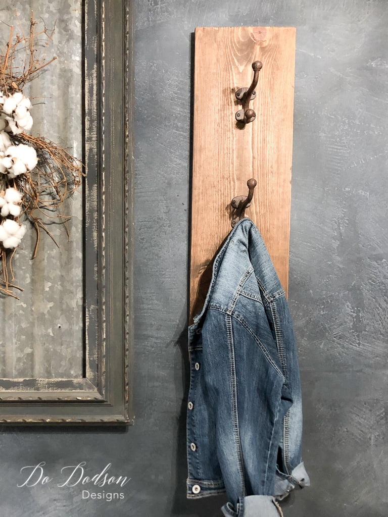 Vertical-style wood coat rack with a jean jacket