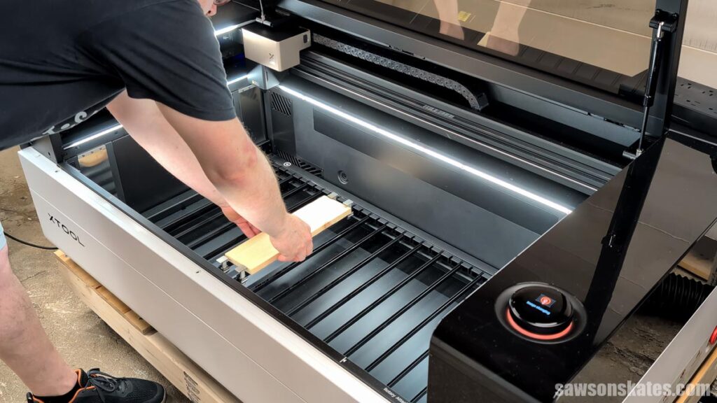 Scott placing a board in an xTool P3 laser cutter