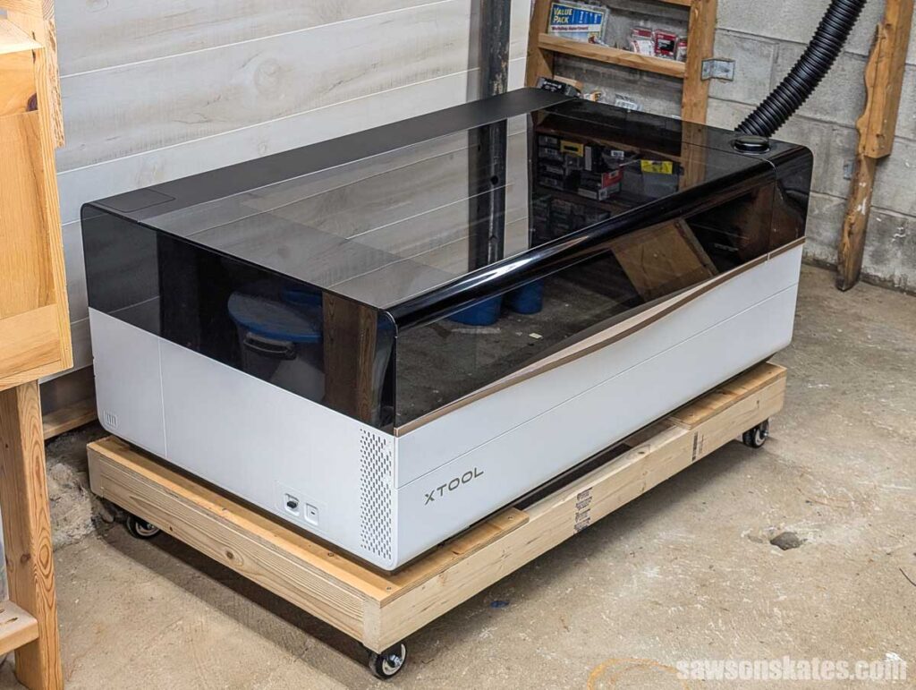 xTool P3 Laser Cutter on a low platform near a concrete floor