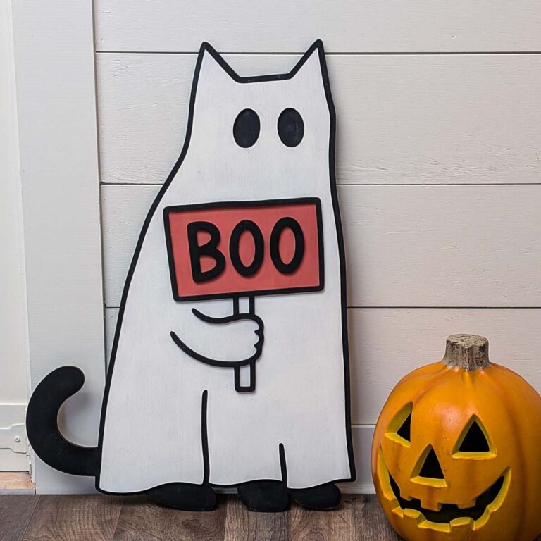 Wooden cat ghost holding a sign that says boo