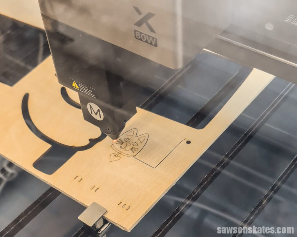 xTool P3 cutting out a cat shape.