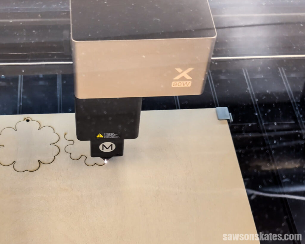 xTool P3 cutting a piece of wood