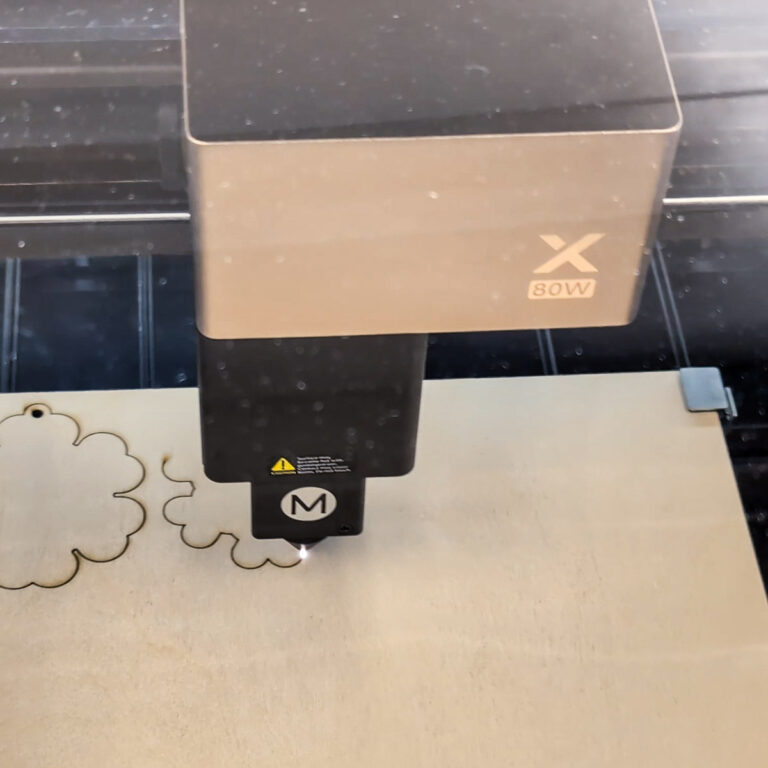 xTool P3 cutting a piece of wood