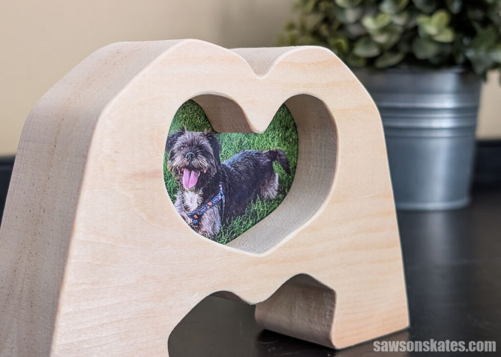 Closeup of a picture frame shaped like making heart with hands