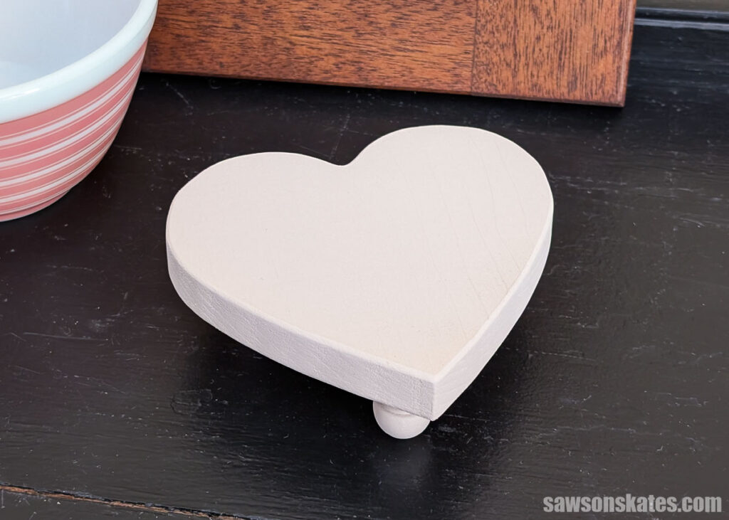 Heart-shaped wood table riser