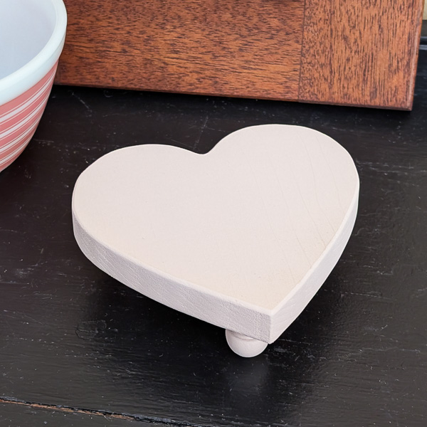 Heart-shaped wood table riser