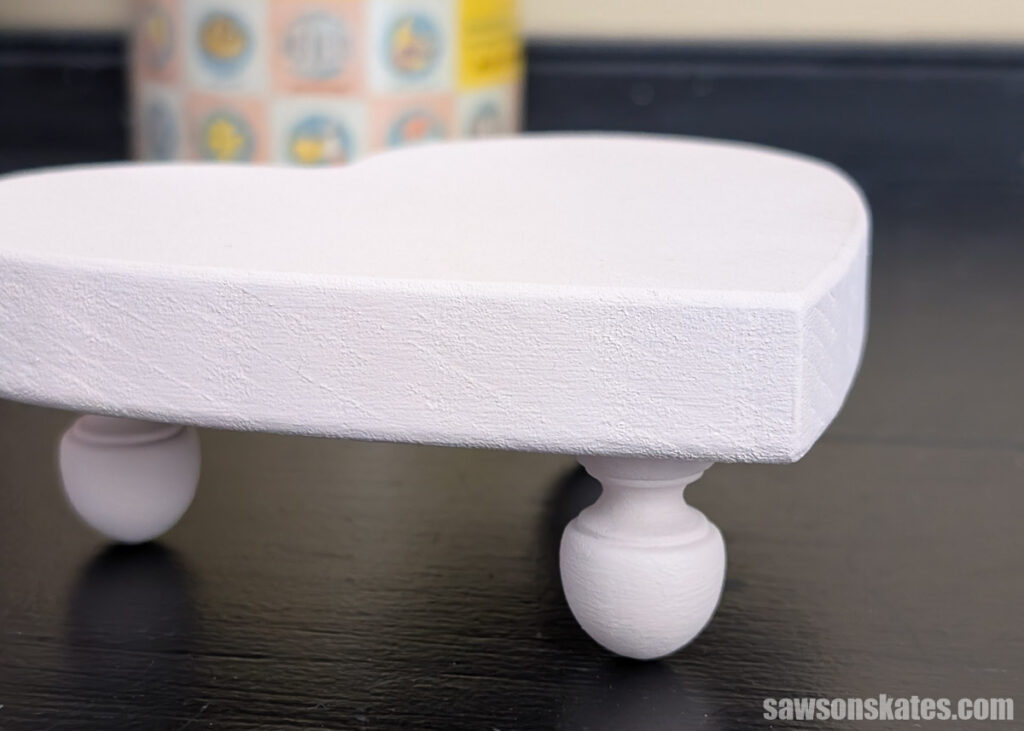 Closeup of a DIY wooden table riser's feet