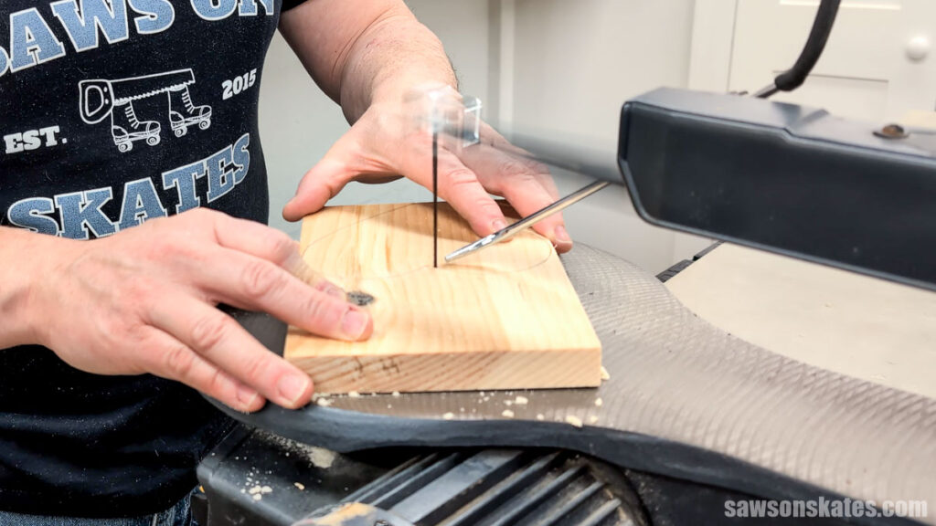 Using a scroll saw to cut out a heart shape