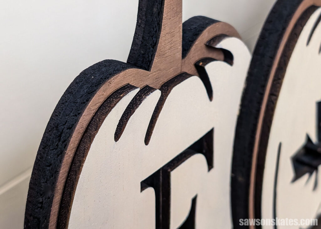 Closeup of a layered fall pumpkin sign