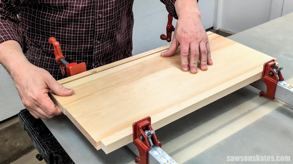 Moving boards back and forth to spread glue