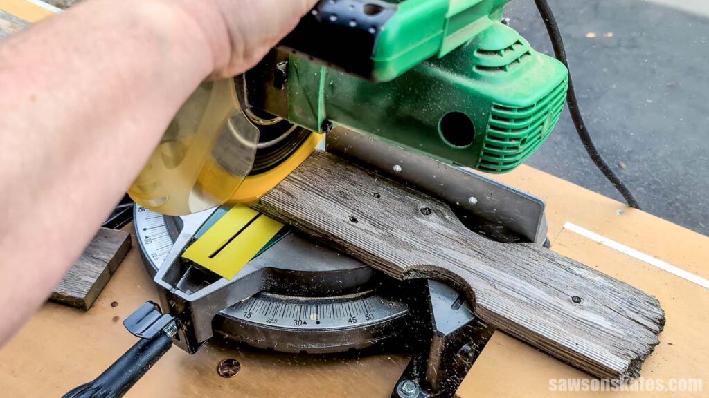 Cutting a fence picket to length with a miter saw