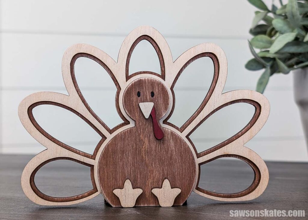 Front view of a wooden thanksgiving tealight holder