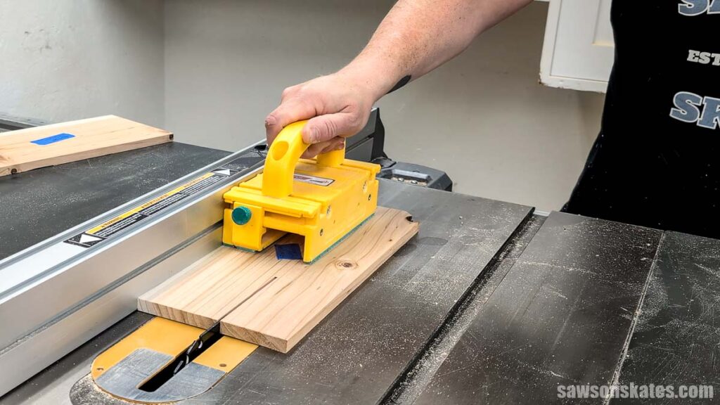 Using a Grrr-ripper to push a workpiece through a table saw