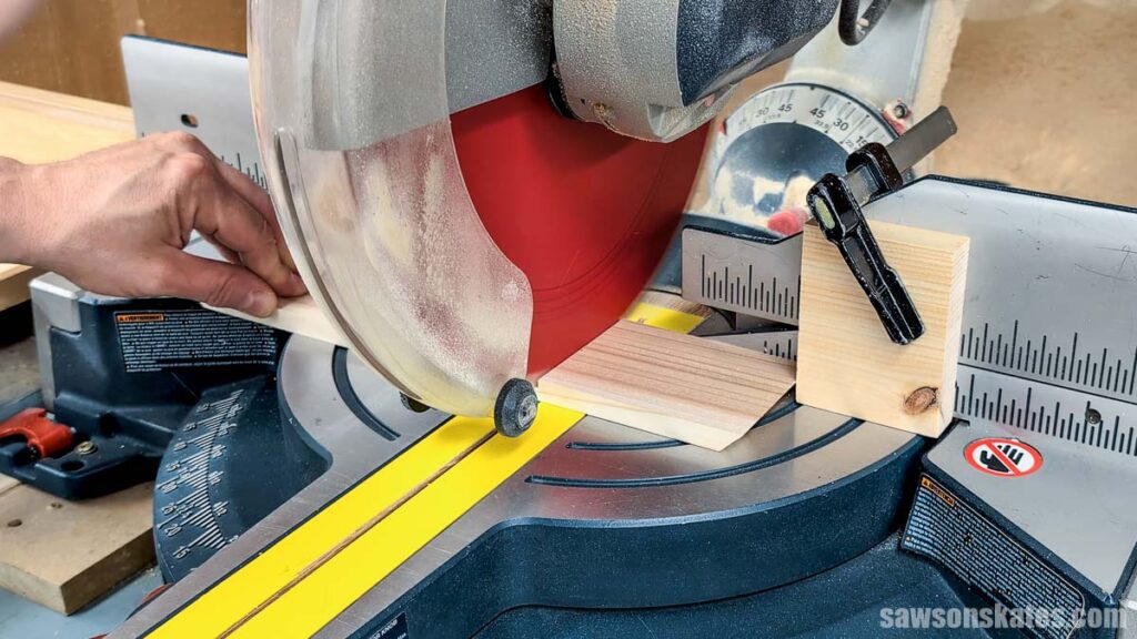 Cutting a board to length with a miter saw