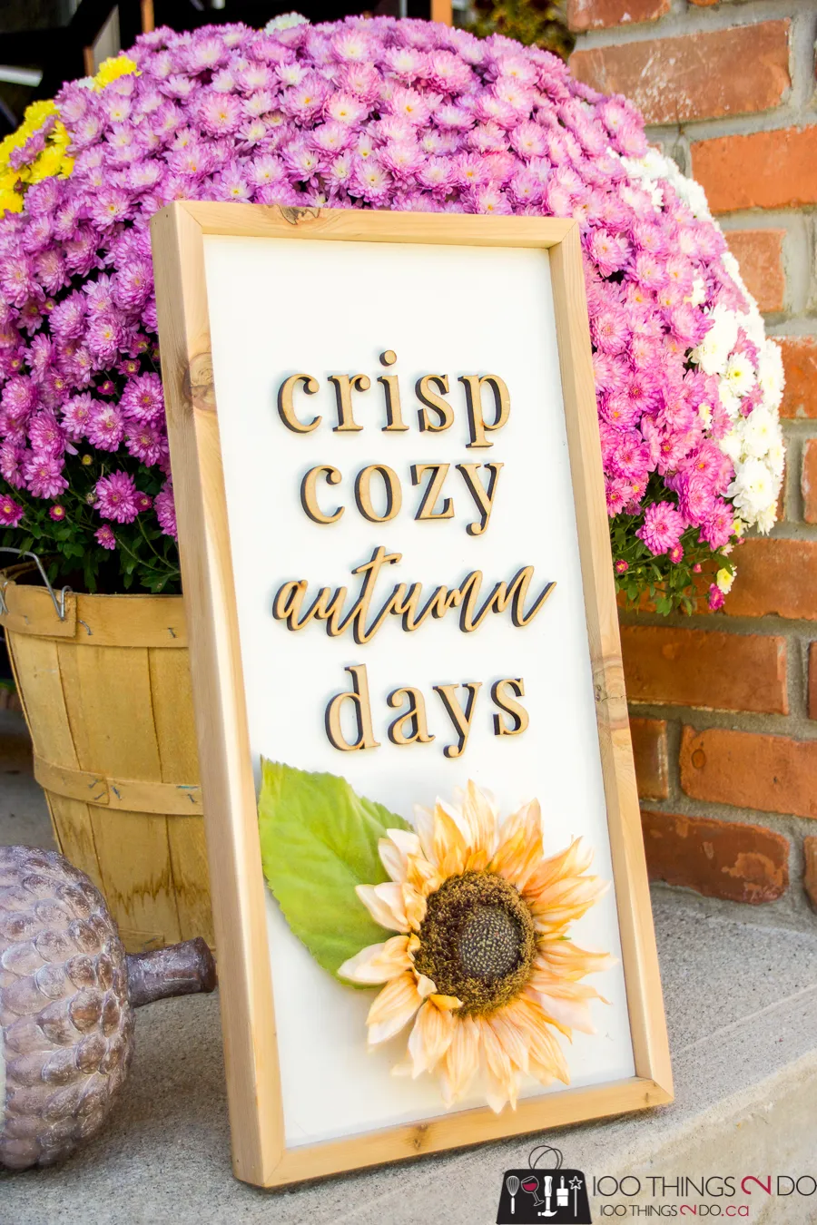 Wooden fall sign that says crisp cozy autumn days