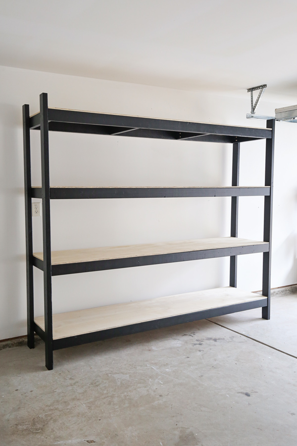 Black and wood garage storage shelf with four open shelves.