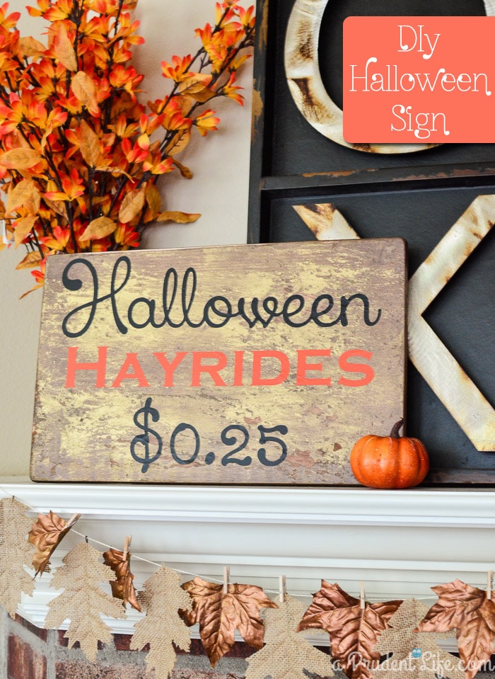 Wooden sign that says Halloween hayrides