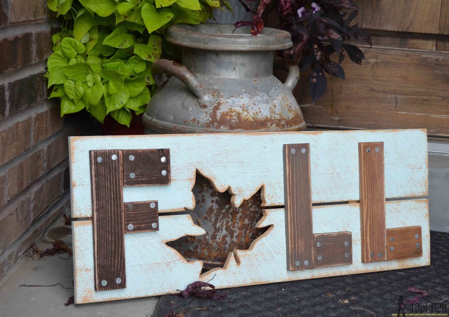Wooden sign that says Fall with a maple leaf replacing the A