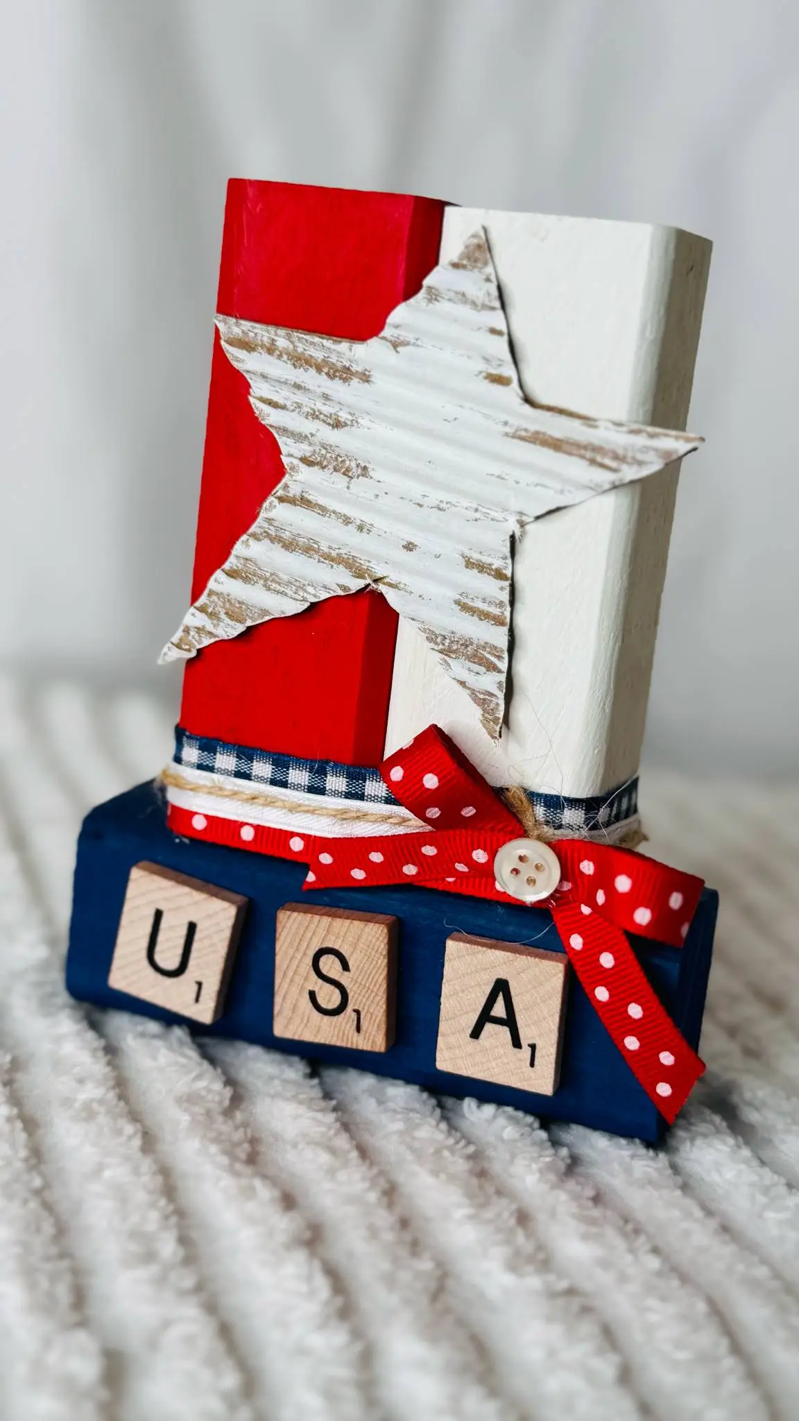 Patriotic tabletop decor made from painted wood blocks in the shape of an Uncle Sam top hat.