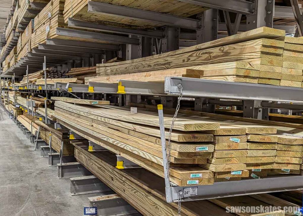 Close-up of pressure treated wood boards with ground contact labels